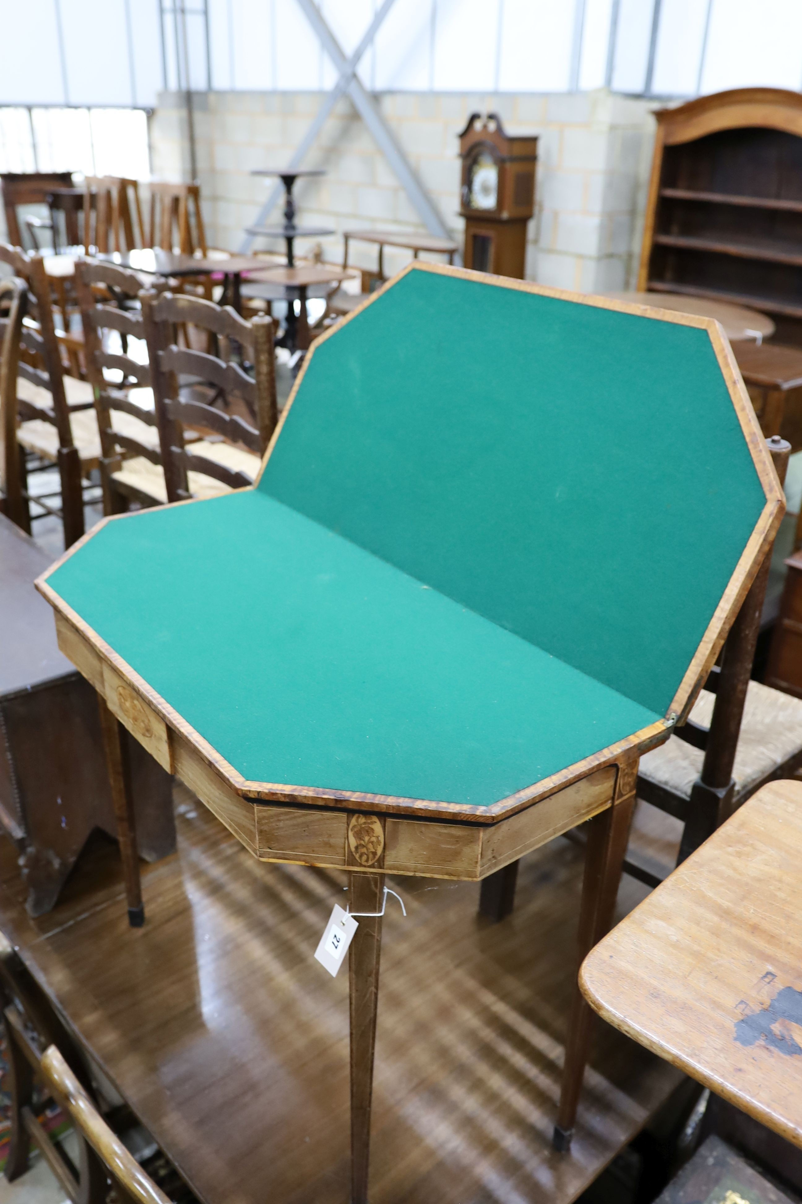 A George III banded and inlaid mahogany folding card table, width 91cm, depth 44cm, height 75cm